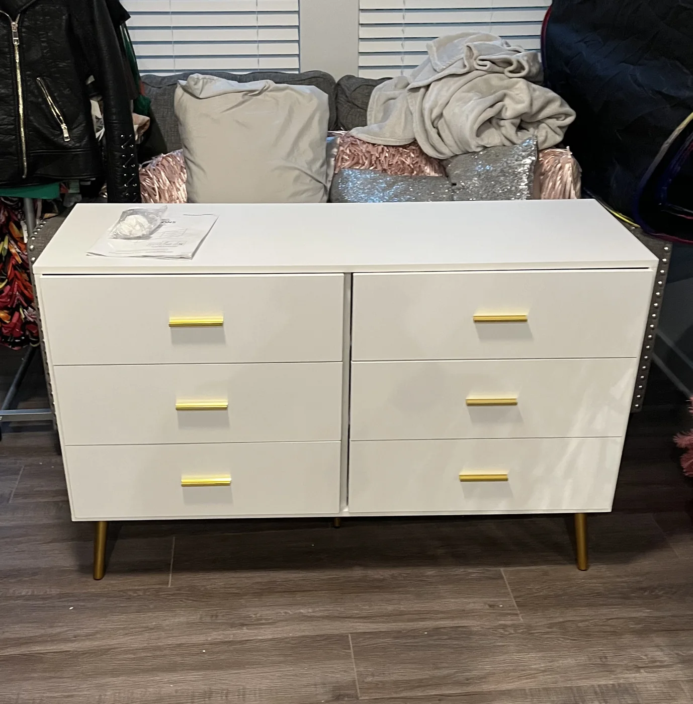 Assembled white six-drawer dresser with gold handles